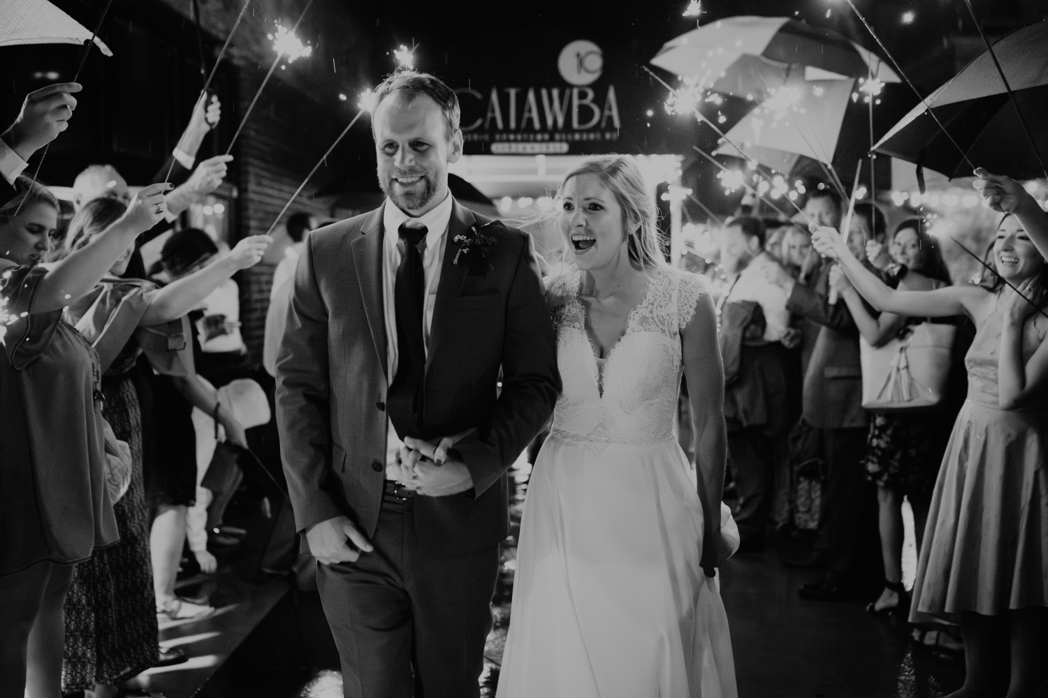 Guests celebrating with the newlyweds in black and white