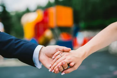 Close-up of a couple holding hands
